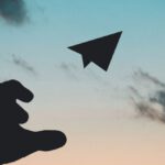 Fly - Silhouette Photo of Man Throw Paper Plane