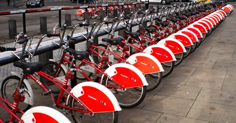 Renting A Car - Parked Red and White Bicycles